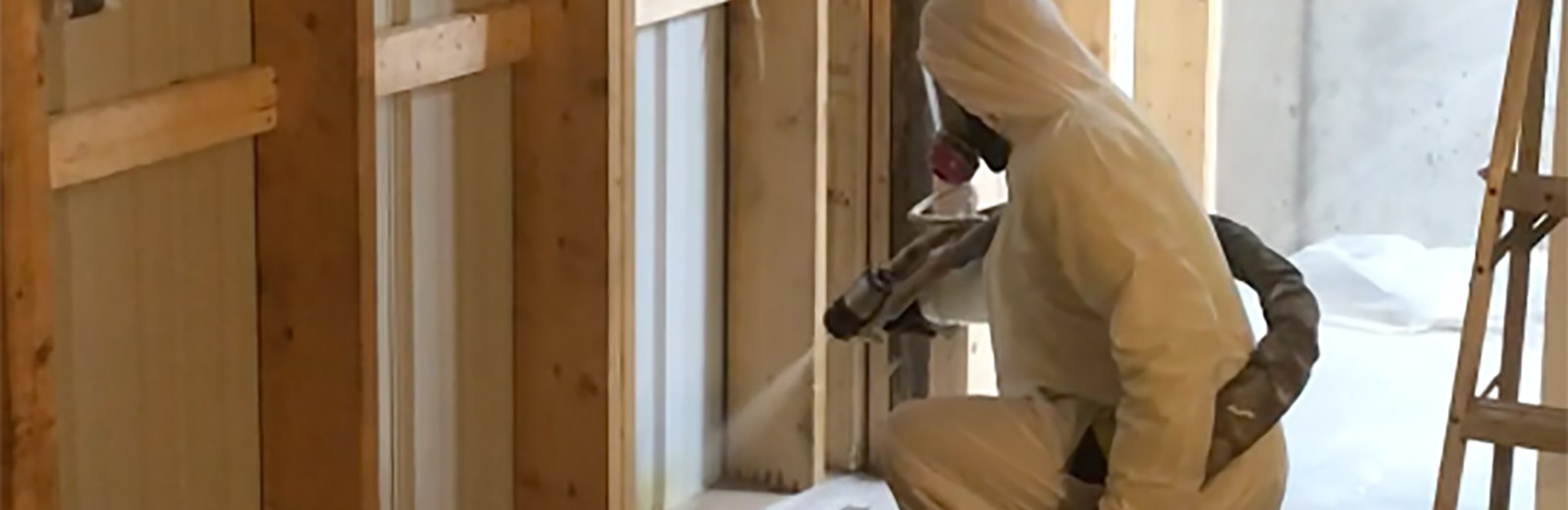 Technician applying spray foam